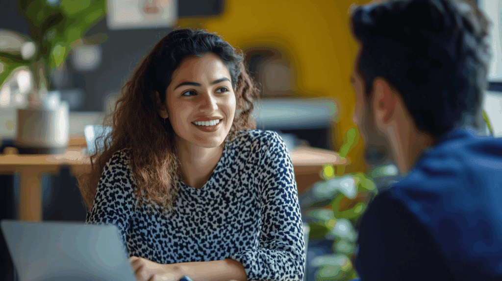 Female colleague talking to her male coworker