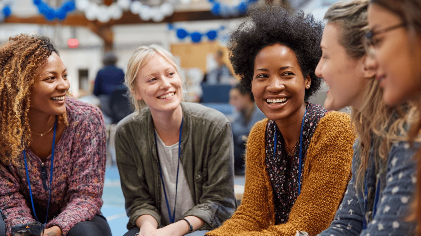 Group of female teachers talking and laughing together